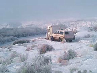 Gary spends his winters living in his 86-square-foot ”Micro Habitat"—a converted 1972 Nomad trailer. In this photo, he is parked 60 miles from town on the Colorado River in January. Outside, the temperature is 15 degrees below freezing. But inside, Gary is  warmed by the winter sun through a large window - cozy enough to play banjo in the nude, he says. 